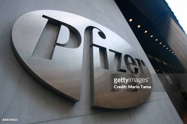 Pfizer sign hangs on the outside of their headquarters after a news conference discussing the planned merger of Pfizer and Wyeth January 26, 2009 in...