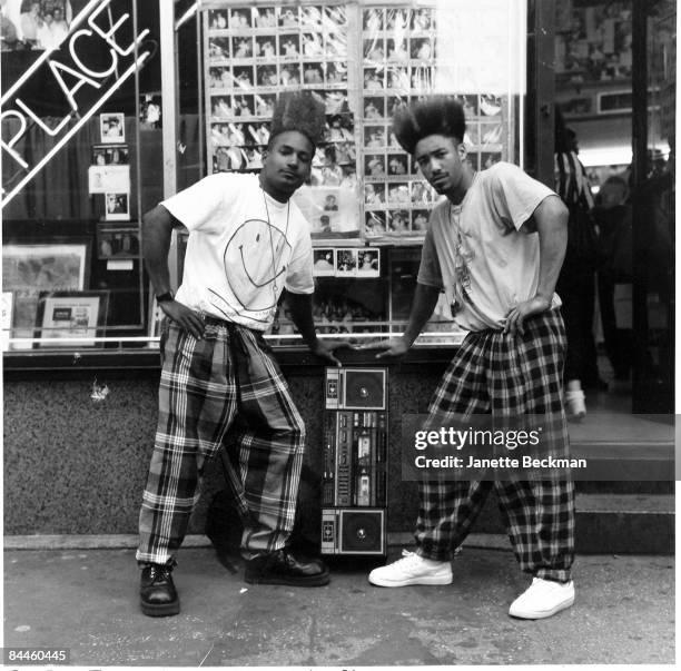 The rap duo Twin Towers pose outside the popular Astor Place barbershop in Manhattan, 1991. They hold a boombox between them.