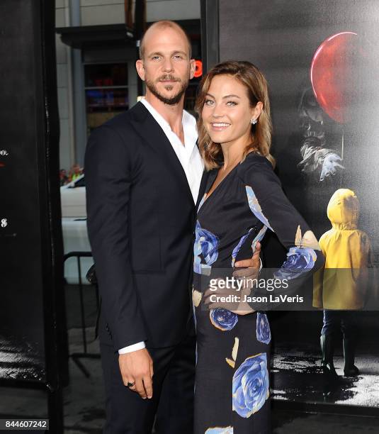 Actor Gustaf Skarsgard and Carolina Sjostrand attend the premiere of "It" at TCL Chinese Theatre on September 5, 2017 in Hollywood, California.