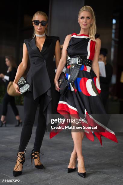 Paris Hilton & Nicky Rothschild-Hilton are seen attending Monse during New York Fashion Week wearing Edie Parker on September 8, 2017 in New York...