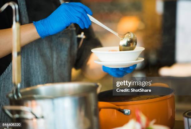 chef coocking soup - soup kitchen stock pictures, royalty-free photos & images