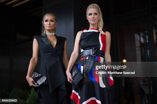 Paris Hilton & Nicky Rothschild-Hilton are seen attending Monse during New York Fashion Week wearing Edie Parker on September 8, 2017 in New York...