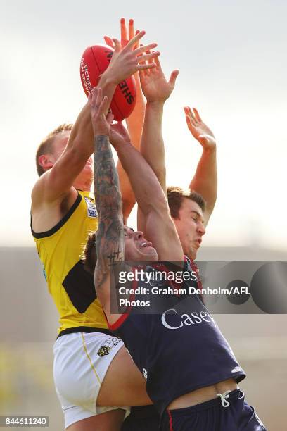Benjamin Kennedy of the Casey Demons competes in the air during the VFL Semi Final match between Casey and Richmond at Fortburn Stadium on September...