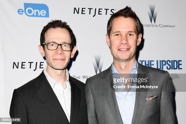 Adam Godley and Jon Hartmere attends the 'The Upside' cocktail party, hosted by RBC and The Weinstein Company, at RBC House Toronto Film Festival...