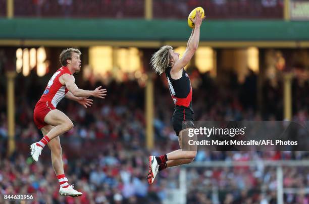 Dyson Heppell of the Bombers marks the ball ahead of Callum Mills of the Swans during the AFL Second Elimination Final match between the Sydney Swans...