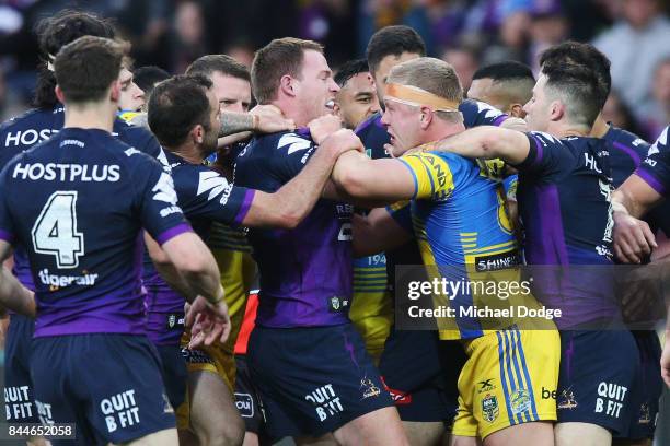 Tim Glasby of the Storm and Daniel Alvaro of the Eels wrestle during the NRL Qualifying Final match between the Melbourne Storm and the Parramatta...