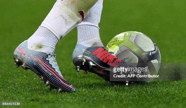Photo shows a detail of Bordeaux's Brazilian midfielder Malcom's football boots reading "MalcomX Familia" as he controls the ball during the French...