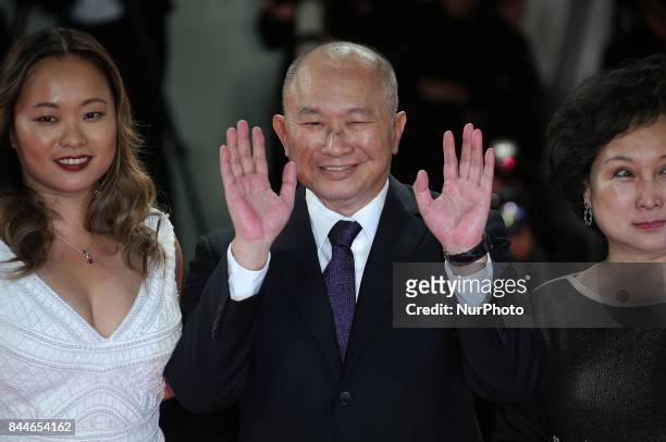 Venice, Italy. 08 September, 2017. Annie Woo Ngau Chun-lung, John Woo and Angeles Woo walk the red carpet ahead of the 'Manhunt ' screening during...