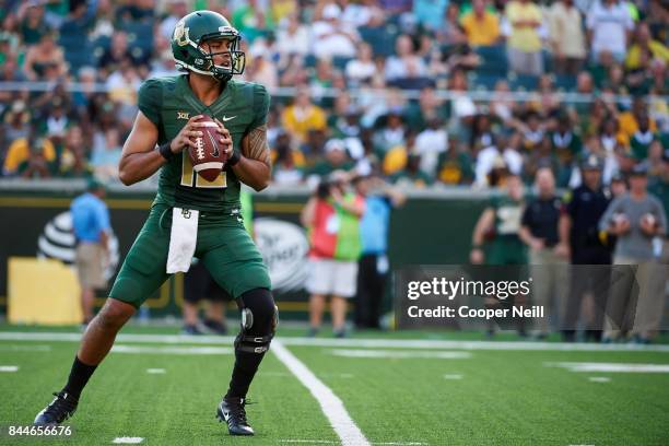 Anu Solomon of the Baylor Bears drops back to pass against the Liberty Flames during a football game at McLane Stadium on September 2, 2017 in Waco,...