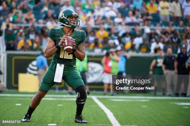 Anu Solomon of the Baylor Bears drops back to pass against the Liberty Flames during a football game at McLane Stadium on September 2, 2017 in Waco,...