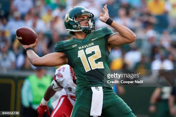 Anu Solomon of the Baylor Bears drops back to pass against the Liberty Flames during a football game at McLane Stadium on September 2, 2017 in Waco,...