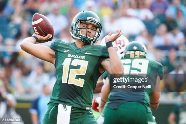 Anu Solomon of the Baylor Bears drops back to pass against the Liberty Flames during a football game at McLane Stadium on September 2, 2017 in Waco,...