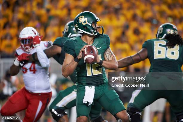 Anu Solomon of the Baylor Bears drops back to pass against the Liberty Flames during a football game at McLane Stadium on September 2, 2017 in Waco,...