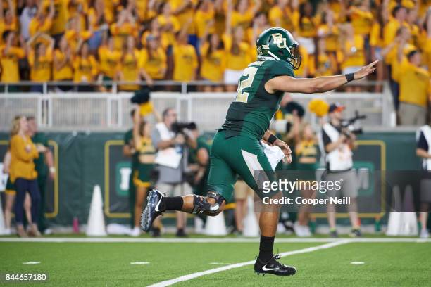 Anu Solomon of the Baylor Bears celebrates after a touchdown pass against the Liberty Flames during a football game at McLane Stadium on September 2,...