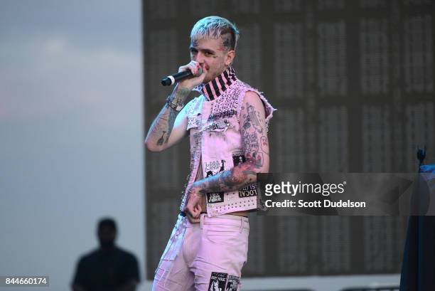 Rapper Lil Peep performs onstage during the Day N Night Festival at Angel Stadium of Anaheim on September 8, 2017 in Anaheim, California.