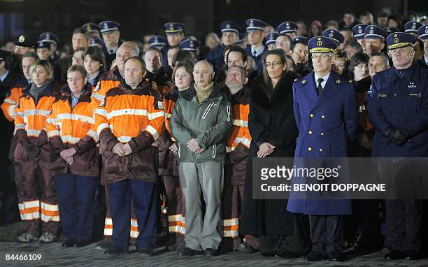 Rescue workers and police attend a commemoration for victims of knife attack at a Belgian creche on January 26 in which accused Kim Van Gelder barged...