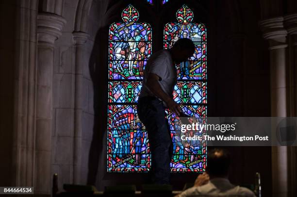 Masons at the National Cathedral build scaffolding before replacing a stained glass window at the National Cathedral depicting Stonewall Jackson and...