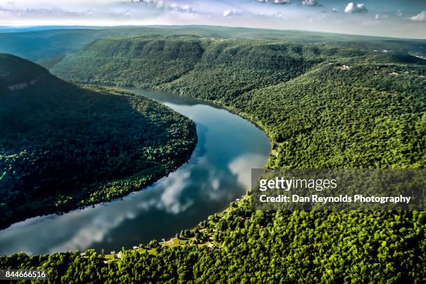 aerial view of river through river gorge with cloud reflections - tennessee stock pictures, royalty-free photos & images
