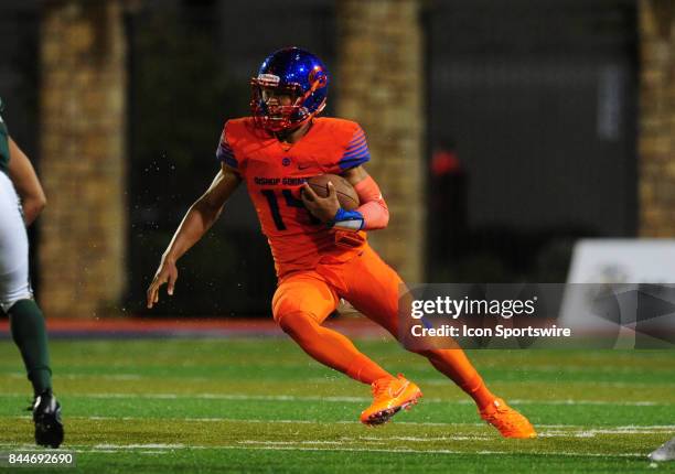 Bishop Gorman quarterback Dorian Thompson-Robinson cuts up the middle against Miami Central in the second quarter of a prep football game between the...