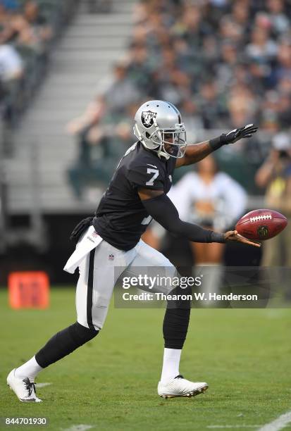 Marquette King of the Oakland Raiders punts the ball against the Seattle Seahawks in the first quarter of their game at the Oakland-Alameda County...
