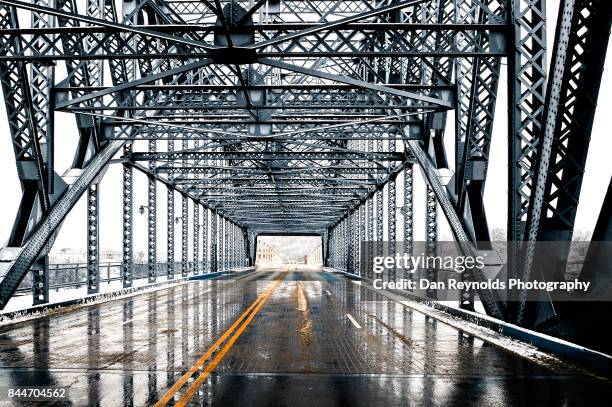 architectural detail of urban bridge after snow and rain with reflection - chattanooga foto e immagini stock