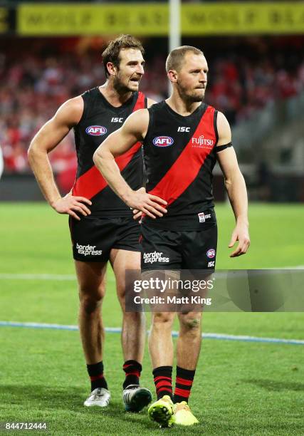 Jobe Watson and James Kelly of the Bombers looks dejected as they leave the field after playing their last AFL match during the AFL Second...