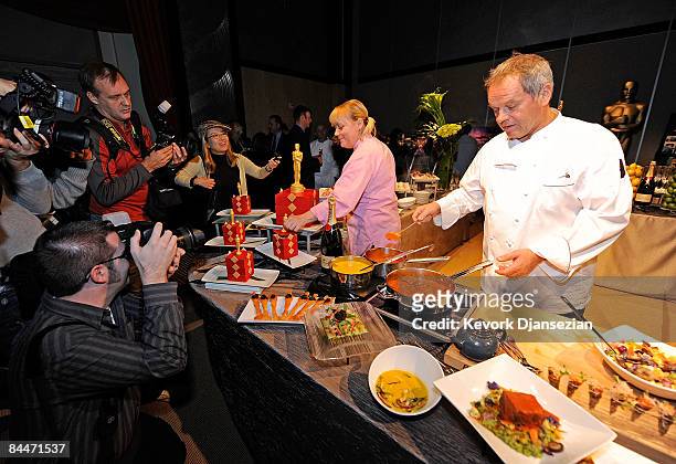Master chef Wolfgang Puck, right, and Sherry Yard, executive pastry chef, cook Governors Ball food during a preview of upcoming 81st annual Academy...