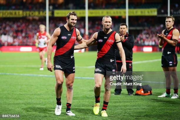 Jobe Watson and James Kelly of the Bombers leave the field after playing their last AFL match during the AFL Second Elimination Final match between...