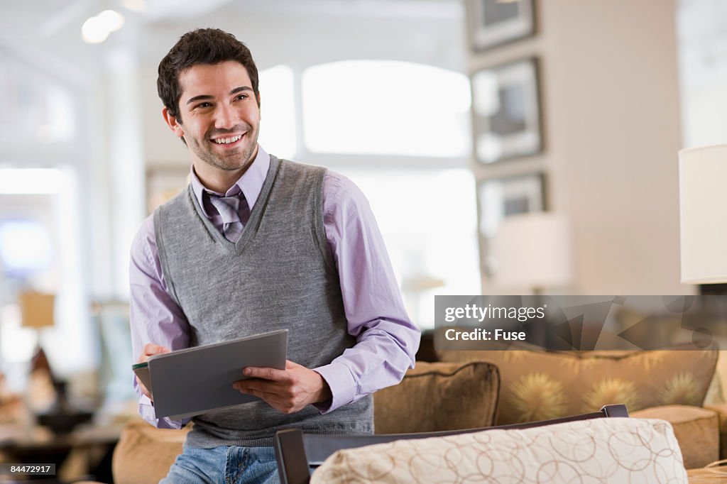 Salesperson Standing in Furniture Store