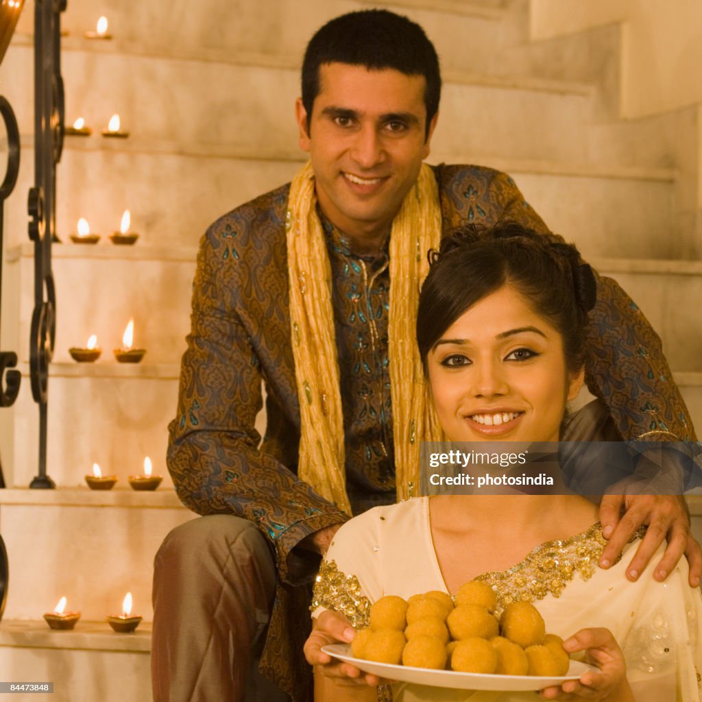 Couple sitting on a staircase and smiling