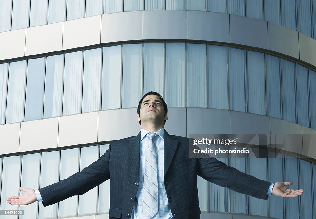 Close-up of a businessman with his arms outstretched