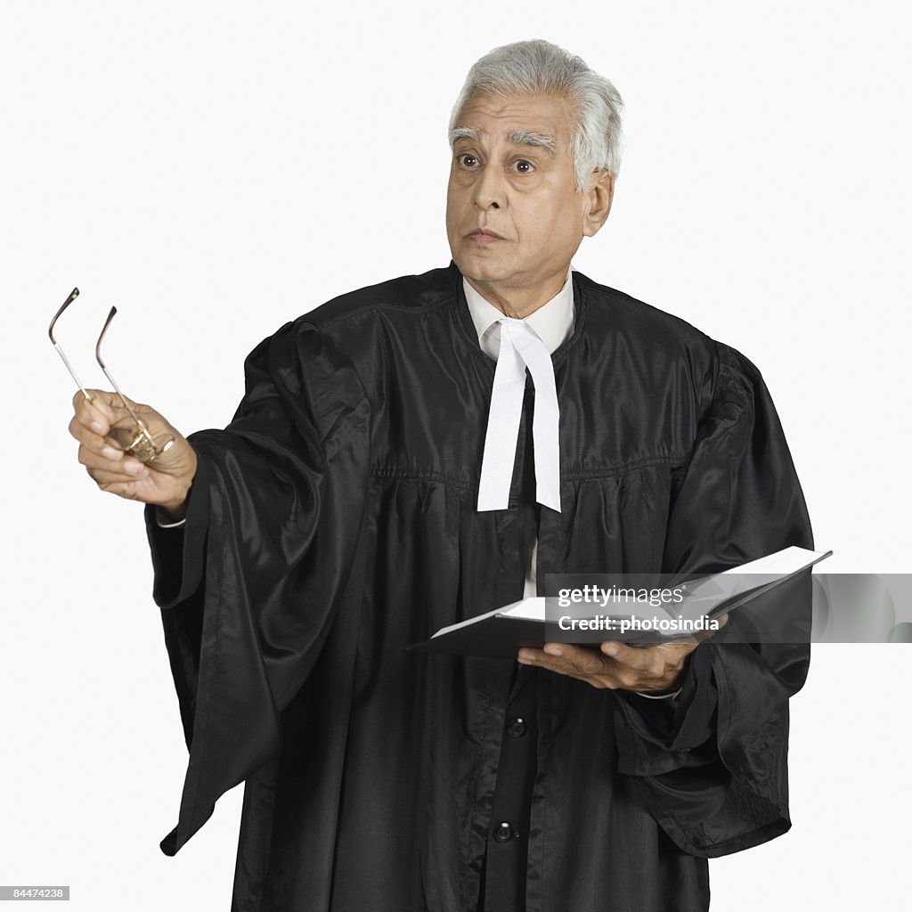 Male lawyer holding a book