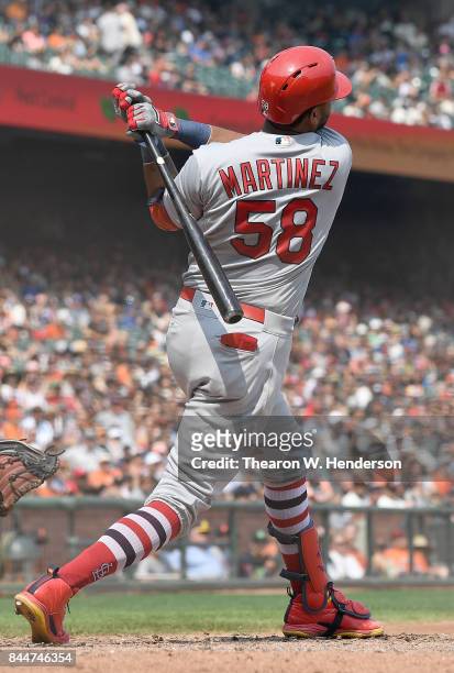 Jose Martinez of the St. Louis Cardinals hits an rbi double scoring Tommy Pham against the San Francisco Giants in the top of the six inning at AT&T...