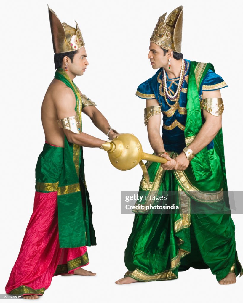 Two young men fighting in the character of Hindu epic
