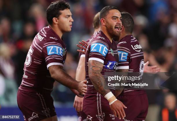 Dylan Walker of the Sea Eagles celebrates scoring a try with team mates during the NRL Elimination Final match between the Manly Sea Eagles and the...