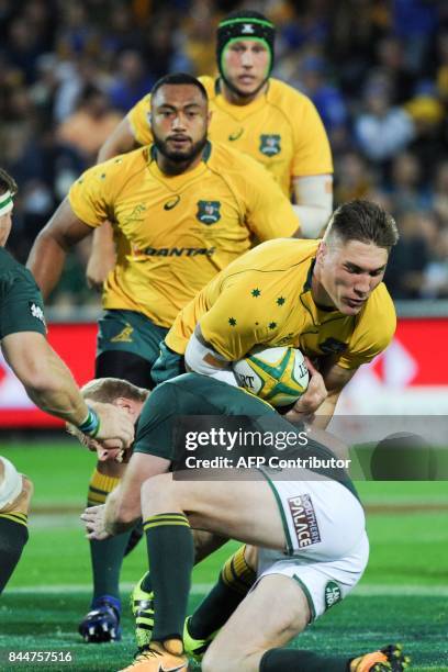 Australia's Sean McMahon is tackled during the Rugby Championship match between Australia and South Africa in Perth on September 9, 2017. / AFP PHOTO...