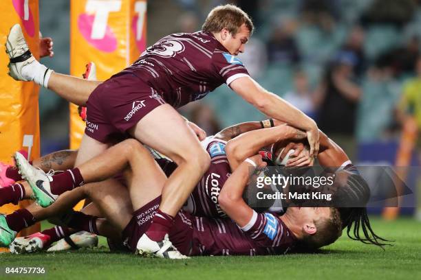 James Tamou of the Panthers is held up over the line during the NRL Elimination Final match between the Manly Sea Eagles and the Penrith Panthers at...