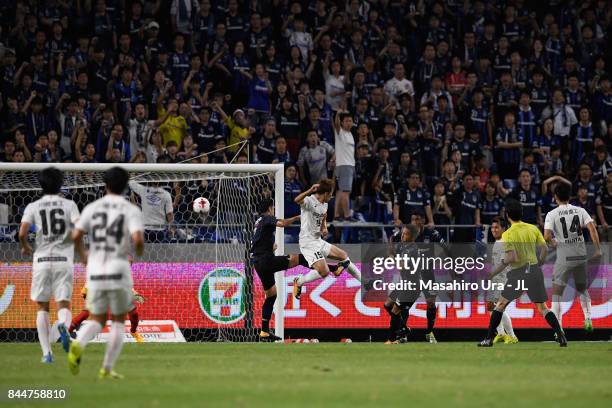 Scores the opening goal during the J.League J1 match between Gamba Osaka and Vissel Kobe at Suita City Football Stadium on September 9, 2017 in...