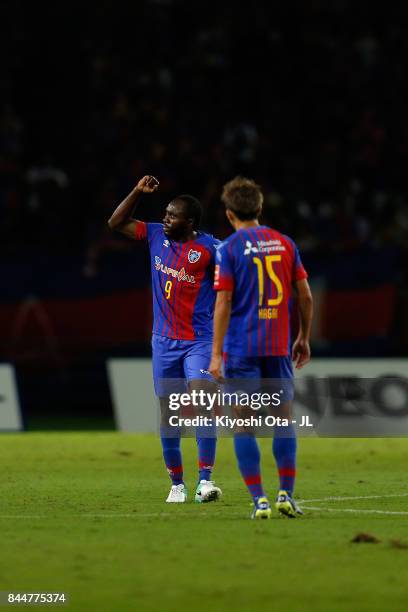 Peter Utaka of FC Tokyo celebrates scoring his side's first goal with his team mate Kensuke Nagai of FC Tokyo during the J.League J1 match between FC...