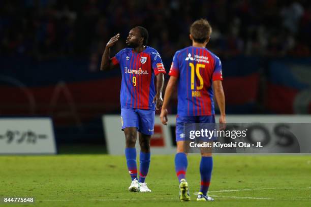 Peter Utaka of FC Tokyo celebrates scoring his side's first goal with his team mate Kensuke Nagai of FC Tokyo during the J.League J1 match between FC...