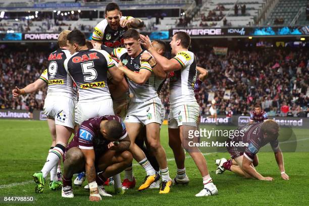 The Panthers celebrate after Bryce Cartwright of the Panthers scored a try during the NRL Elimination Final match between the Manly Sea Eagles and...