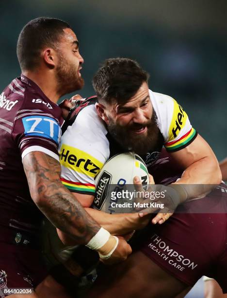 Josh Mansour of the Panthers is tackled by Dylan Walker of the Sea Eagles during the NRL Elimination Final match between the Manly Sea Eagles and the...