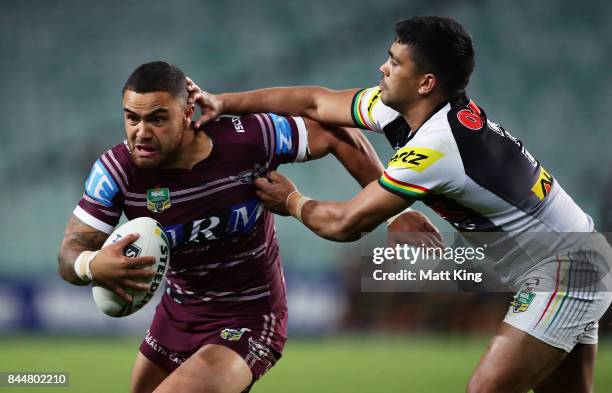 Dylan Walker of the Sea Eagles is tackled by Tyrone Peachey of the Panthers during the NRL Elimination Final match between the Manly Sea Eagles and...