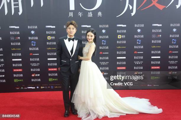 Actor Jia Nailiang and his wife actress Li Xiaolu arrive at the red carpet of 2017 Bazaar Star Charity Night on September 9, 2017 in Beijing, China.