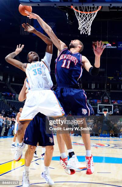 Brook Lopez of the New Jersey Nets blocks the ball against Kevin Durant of the Oklahoma City Thunder at the Ford Center on January 26, 2009 in...