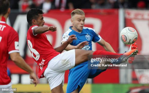 Ahmed Waseem Razeek of Erfurt challenges Guillaume Cros of Jena during the 3.Liga match between FC Rot Weiss Erfurt and FC Carl Zeiss Jena at...