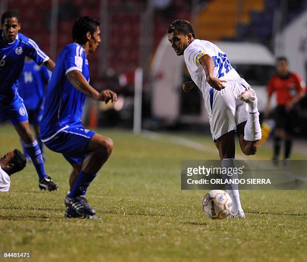 Hondura's footballer, Amado Guevara vies for the ball with El Salvador, Ramon Sanchez , during their UNCAF Nations Cup match on January 26, 2009 at...