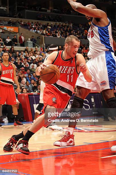 Sergio Rodriguez of the Portland Trail Blazers drives along the baseline against Brian Skinner of the Los Angeles Clippers at Staples Center on...