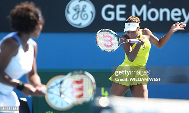 Venus and Serena Williams of the US return the ball to Peng Shuai of China and partner Hsieh Su-Wei of Taiwan during their women's doubles tennis...
