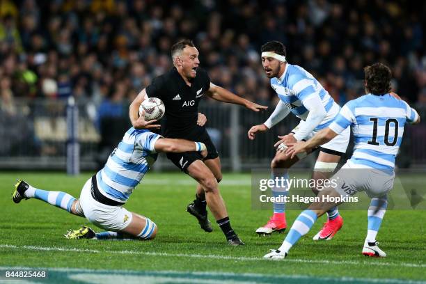 Israel Dagg of New Zealand is tackled by Matias Alemanno of Argentina during The Rugby Championship match between the New Zealand All Blacks and...